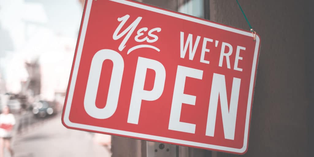 sign that says: Yes we're open
