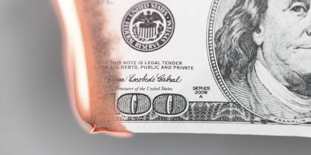 $100 bill on fire