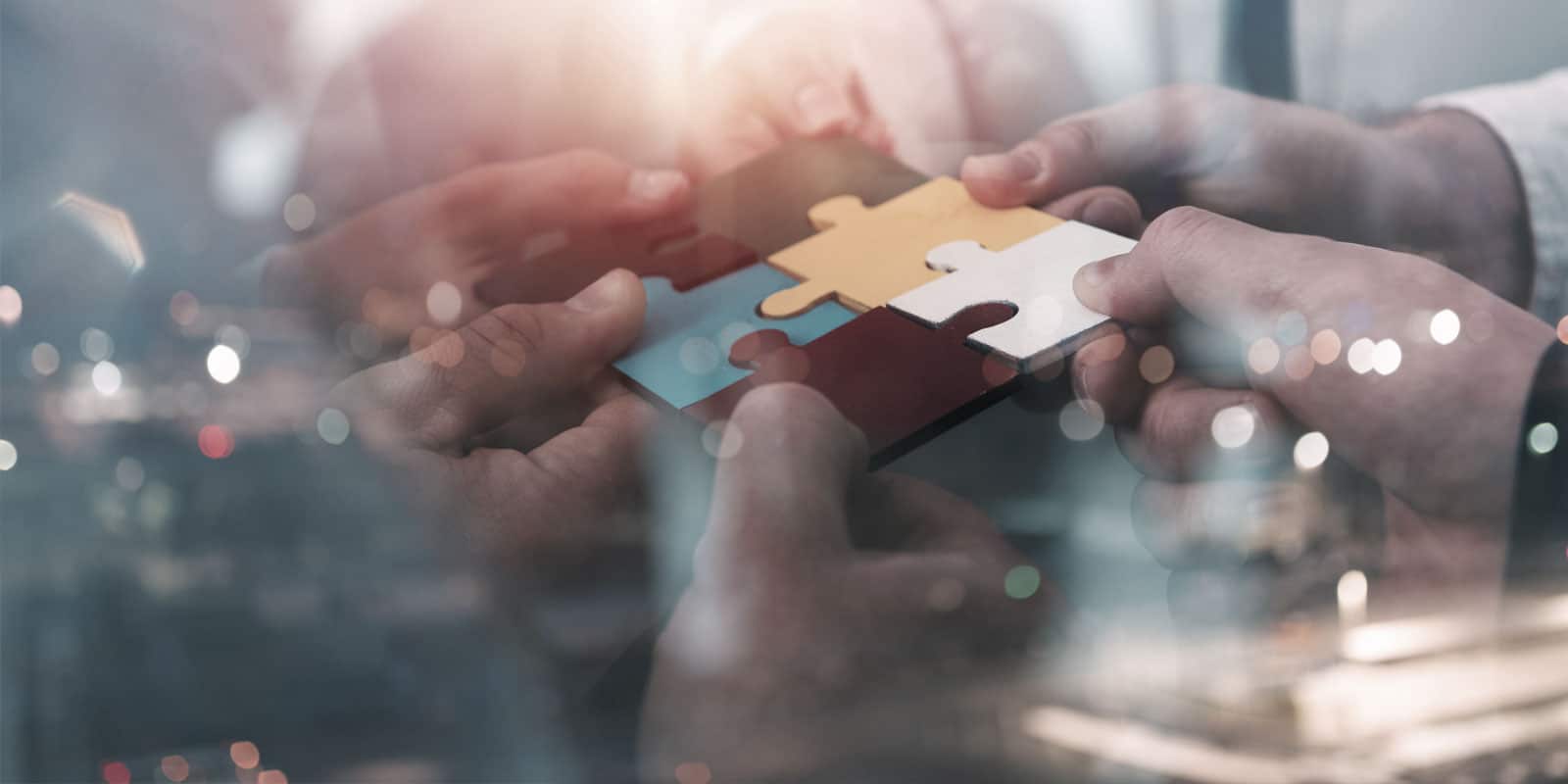 People putting puzzle pieces together