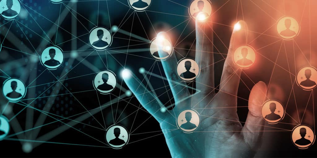 hand touching icons of digital people