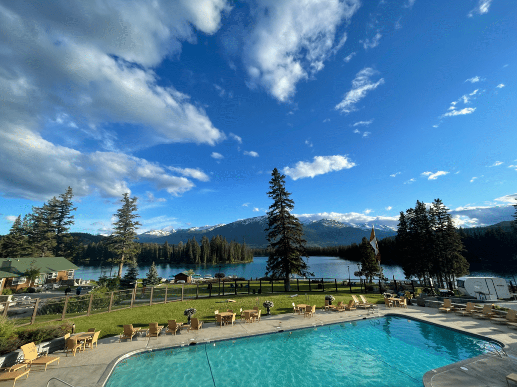 Pool with mountains and blue skies in the background