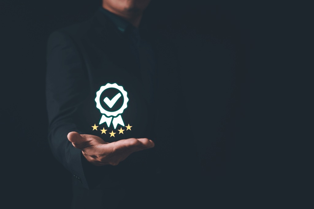 Businessman holding and showing the best quality assurance. Quality control certification and standardization. ISO service concept.