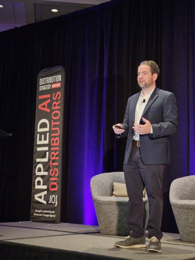 Brooks speaking on stage at Applied AI for Distributors
