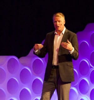 Justin King speaking on stage